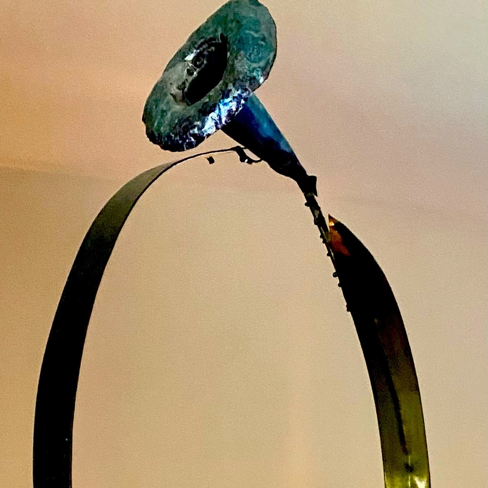 Handmade art piece. Metal flower on wood base.